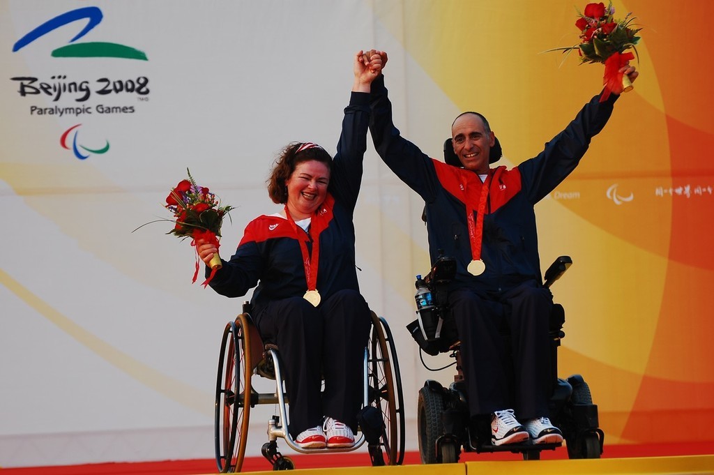 An elated Maureen Mckinnon-Tucker (left) inaugural winner of the Nick Scandone Award, with her skipper, Nick Scandone (USA) after being awarded their Gold Medals at the 2008 Paralympics - Qingdao © Dan Tucker http://sailchallengeinspire.org/